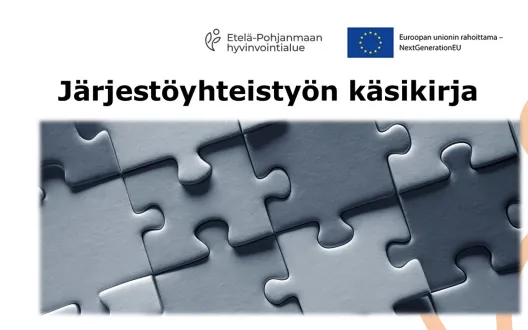 Kuva palapelistä ja otsikko