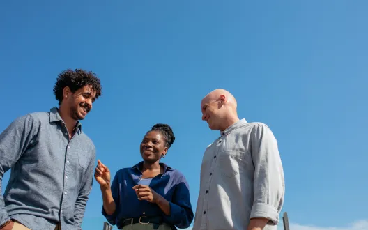 Three people chatting